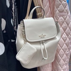 Kate Spade Rosie Medium Flap Backpack 
K8714 pebbled leather Parchment rosie
NWT
